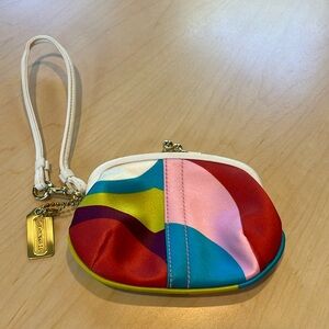 Coach pretty Multi-Color  Coin Purse Wristlet. Kissing lock closure. Never used.